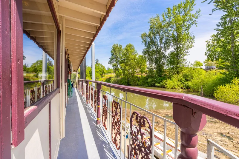 Slide: The Image of Side view of 1990 Custom Howdy Eidelman Sternwheeler, Jack Sarin model, on a scenic river. - 45
