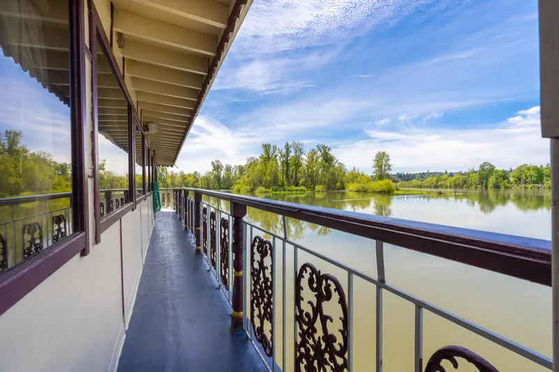 Slide: The Image of Side view of 1990 Custom Howdy Eidelman Sternwheeler on a serene river. - 48