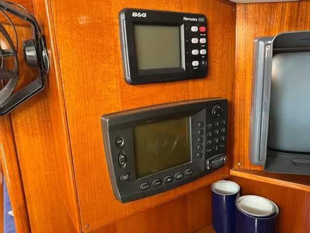 Slide: The Image of Navigation instruments on 1979 Palmer Johnson New York 40 Sloop's wooden interior panel. - 15