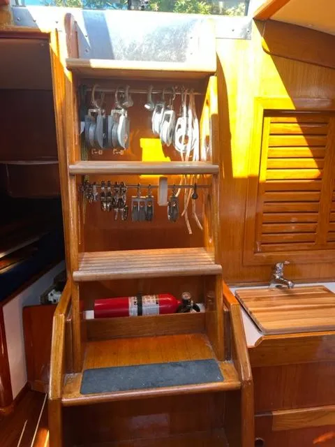 Slide: The Image of Interior of 1979 Palmer Johnson New York 40 Sloop with wooden steps and nautical equipment. - 20