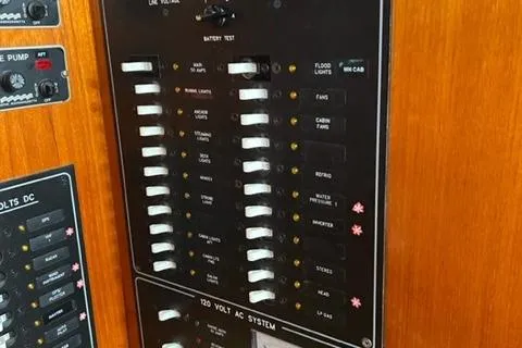 Slide: The Image of Control panel of a 1979 Palmer Johnson New York 40 Sloop, featuring various switches and indicators. - 24