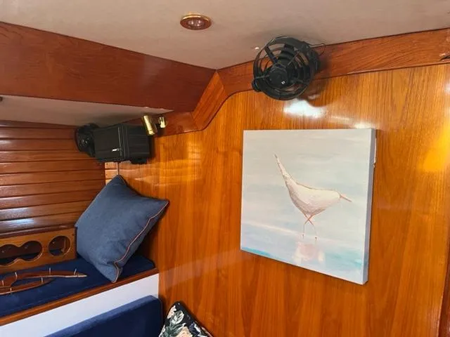 Slide: The Image of Interior of 1979 Palmer Johnson New York 40 Sloop with wooden paneling and bird artwork. - 26