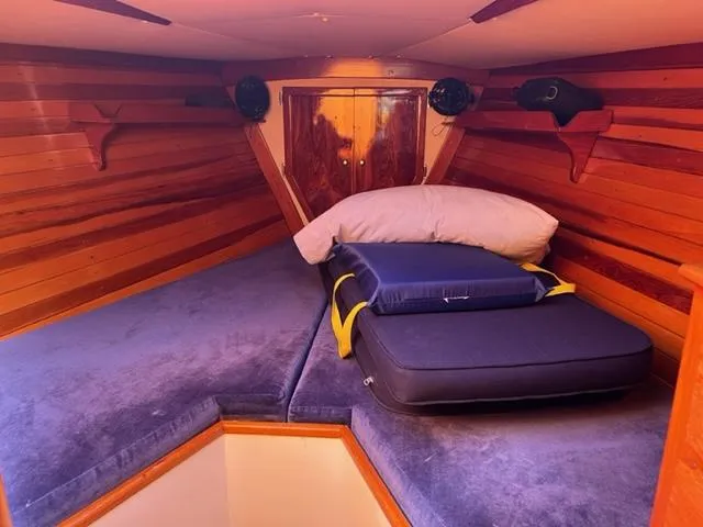 Slide: The Image of Cozy cabin interior of 1979 Palmer Johnson New York 40 Sloop with wooden paneling. - 27