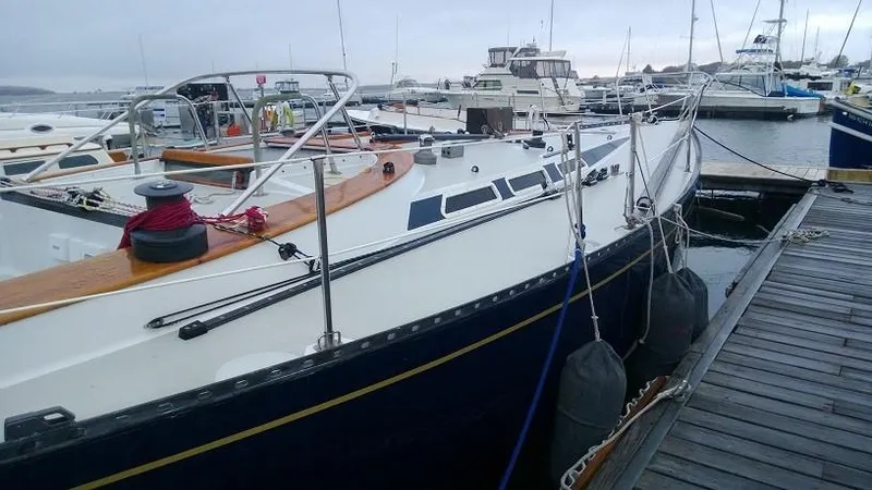 Slide: The Image of 1979 Palmer Johnson New York 40 Sloop docked at marina, showcasing sleek design and craftsmanship. - 3