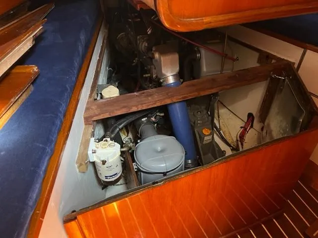 Slide: The Image of Engine compartment of a 1979 Palmer Johnson New York 40 Sloop, showcasing mechanical components. - 34