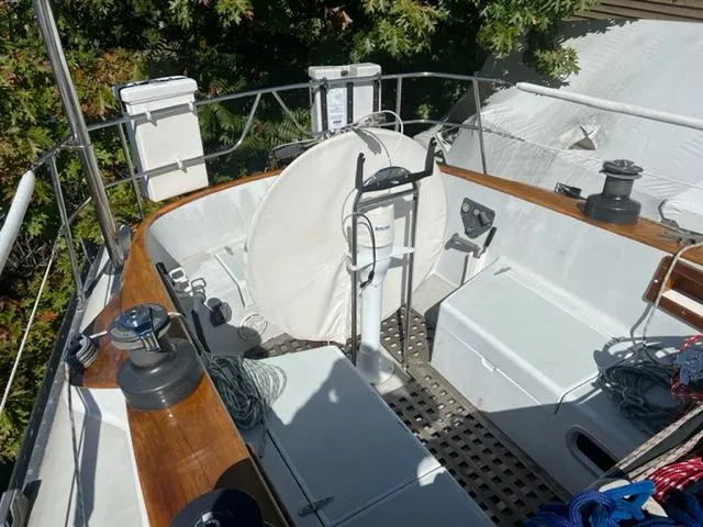 Slide: The Image of 1979 Palmer Johnson New York 40 Sloop cockpit with wooden trim and sailing equipment. - 39