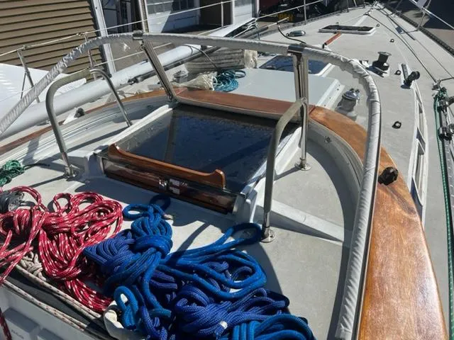 Slide: The Image of Deck of 1979 Palmer Johnson New York 40 Sloop with ropes and hatch. - 42