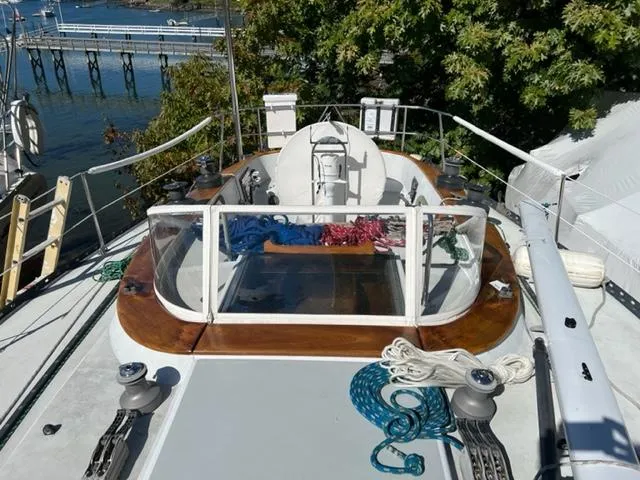 Slide: The Image of 1979 Palmer Johnson New York 40 Sloop deck with ropes and winches, dockside view. - 43