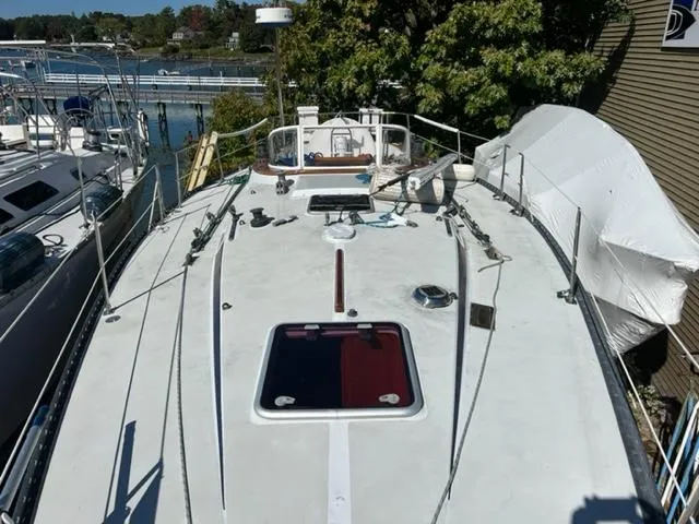 Slide: The Image of 1979 Palmer Johnson New York 40 Sloop on deck, docked near other boats. - 44