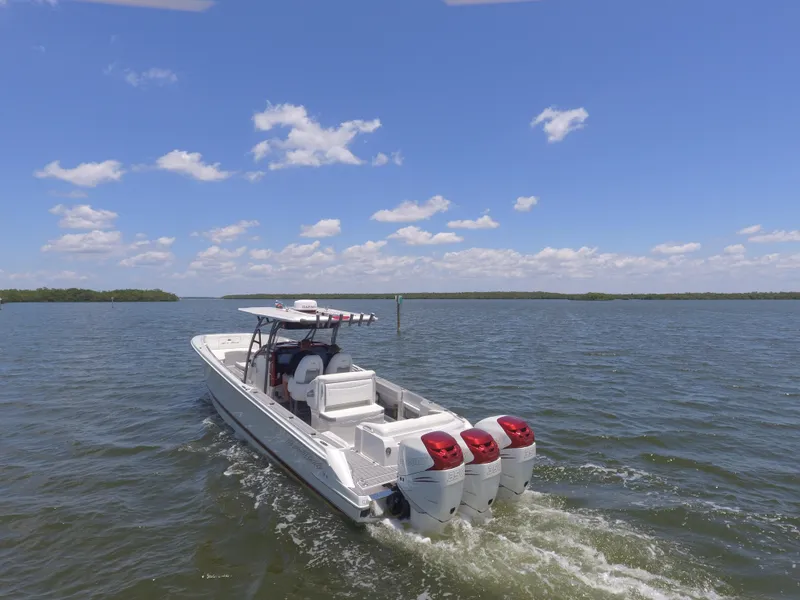 Slide: The Image of 2017 Nor-Tech 390 Sport boat cruising on a sunny day. - 10