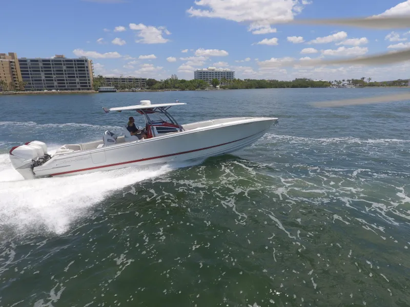 Slide: The Image of 2017 Nor-Tech 390 Sport boat cruising on a sunny day. - 15