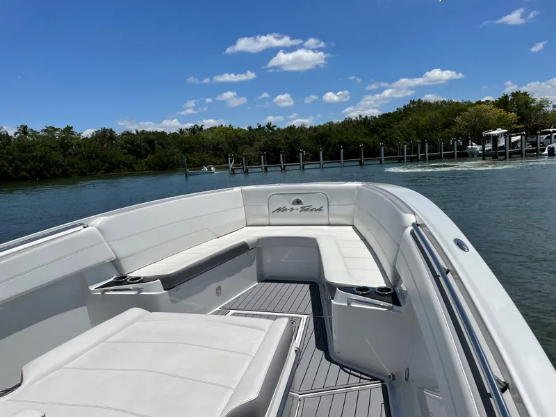 Slide: The Image of 2017 Nor-Tech 390 Sport boat with white seating on a sunny day. - 35
