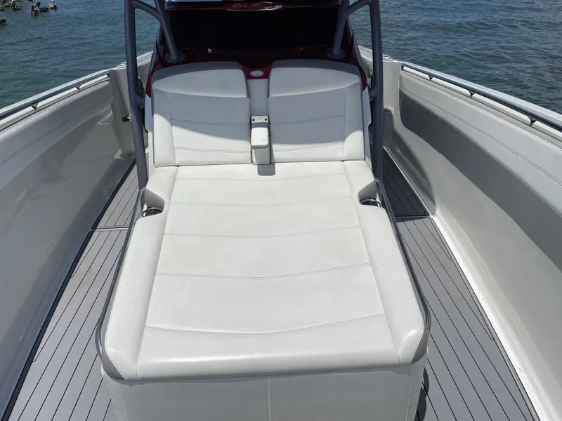Slide: The Image of 2017 Nor-Tech 390 Sport boat with white cushioned seating on deck. - 36