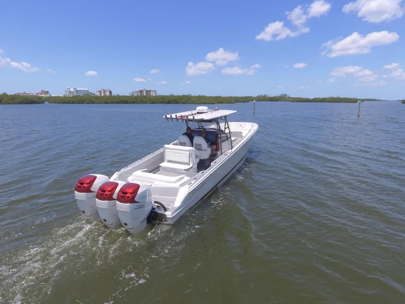 Slide: The Image of 2017 Nor-Tech 390 Sport boat cruising on a sunny day. - 4