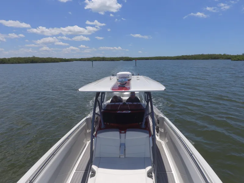 Slide: The Image of 2017 Nor-Tech 390 Sport boat cruising on a sunny day. - 9