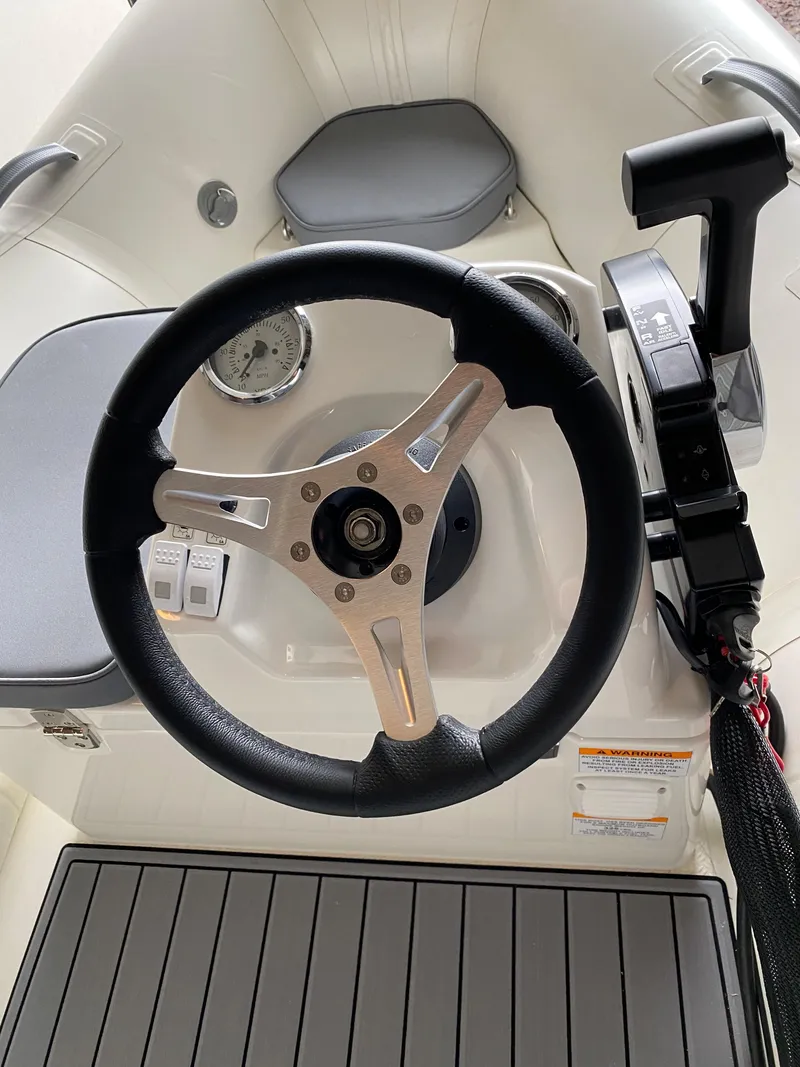 Slide: The Image of Steering console of a 2022 Brig Falcon 330 boat. - 4