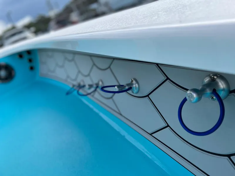 Slide: The Image of Close-up of 2022 Xplor X7 boat interior with blue accents and hooks. - 10