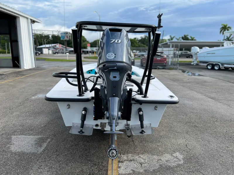 Slide: The Image of Xplor X7 2022 boat with 70 HP outboard motor in a marina. - 12