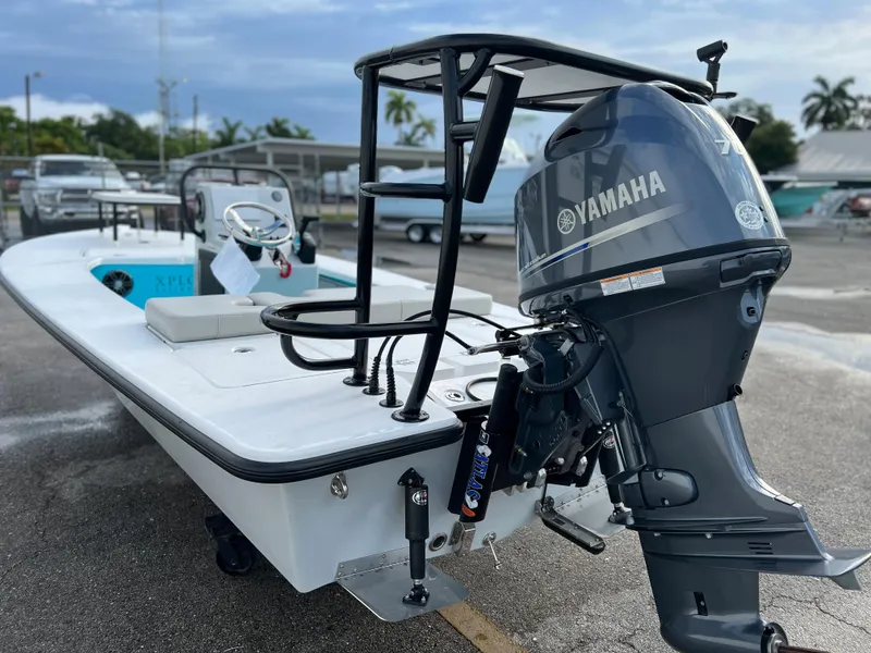 Slide: The Image of 2022 Xplor X7 boat with Yamaha outboard motor in a marina. - 5