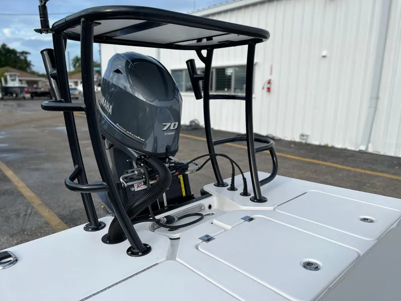 Slide: The Image of 2022 Xplor X7 boat with Yamaha 70 outboard motor in a parking lot. - 8