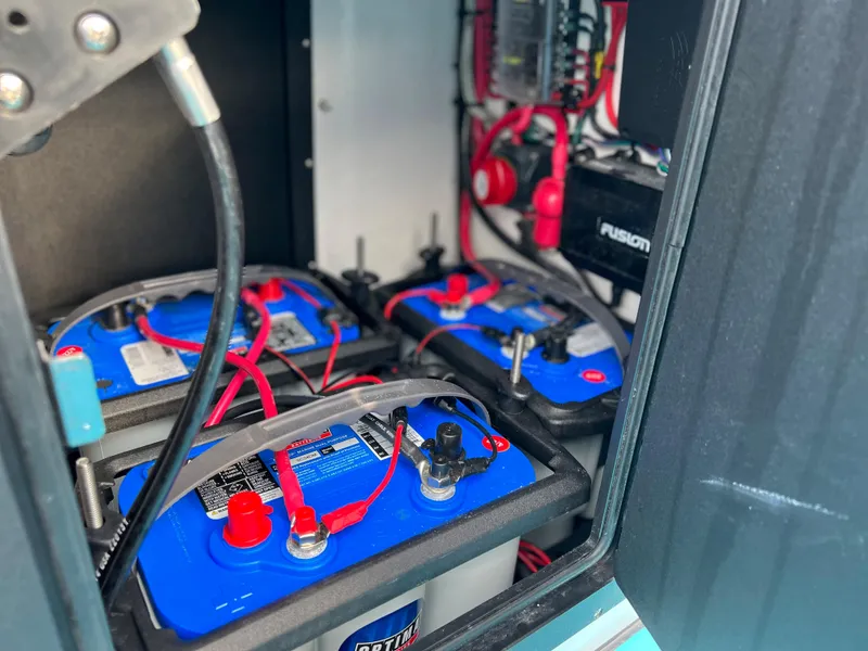 Slide: The Image of 2022 Xplor X7 battery compartment with multiple blue batteries and wiring. - 9