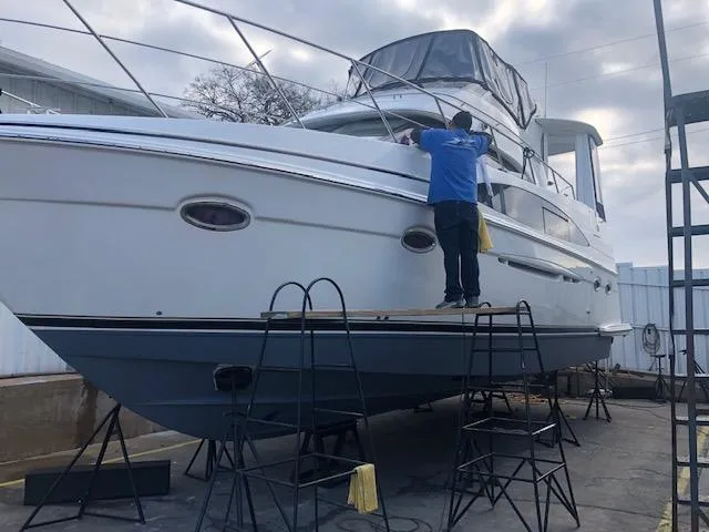 Slide: The Image of 2002 Carver 396 Aft Cabin MY yacht being cleaned on dry dock. - 14
