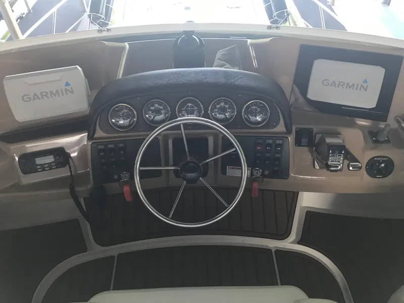 Slide: The Image of 2002 Carver 396 Aft Cabin MY helm with Garmin navigation displays and steering wheel. - 20
