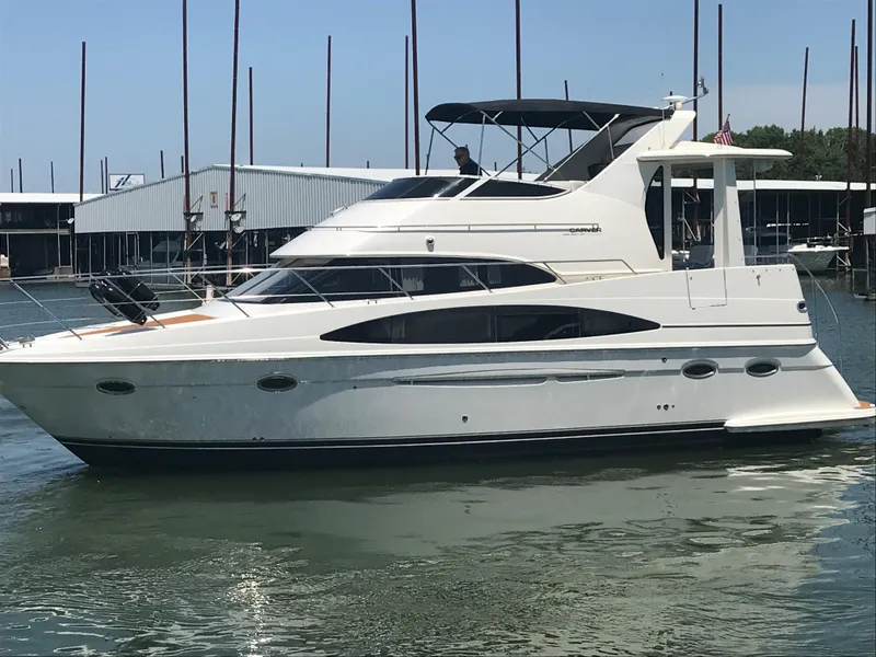 Slide: The Image of 2002 Carver 396 Aft Cabin MY yacht docked in marina, side view. - 2