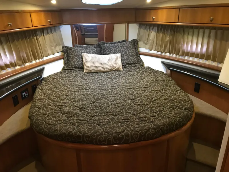 Slide: The Image of Luxurious cabin interior of 2002 Carver 396 Aft Cabin MY yacht with elegant bedding. - 22