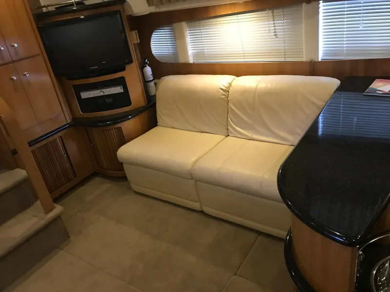 Slide: The Image of Interior of 2002 Carver 396 Aft Cabin MY with sofa and entertainment area. - 32