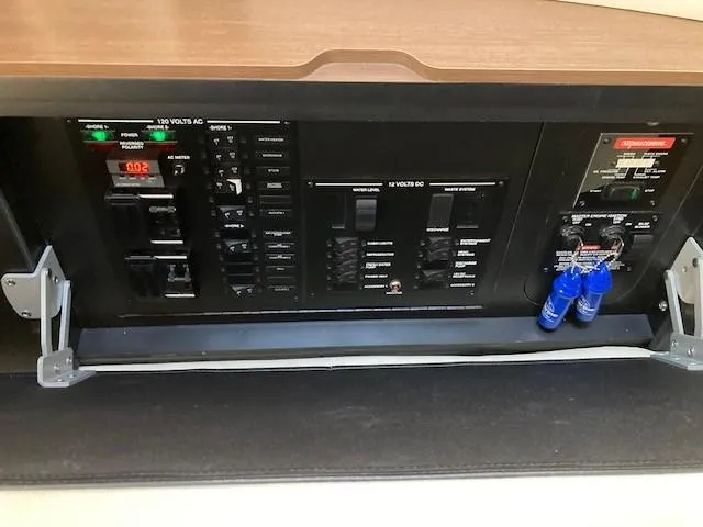 Slide: The Image of Electrical control panel of a 2019 Sea Ray 350 Sundancer boat. - 14