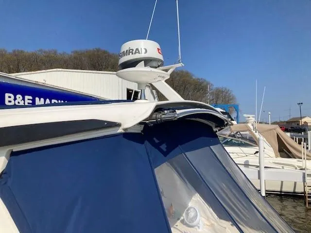 Slide: The Image of 2019 Sea Ray 350 Sundancer at marina with Simrad radar. - 2
