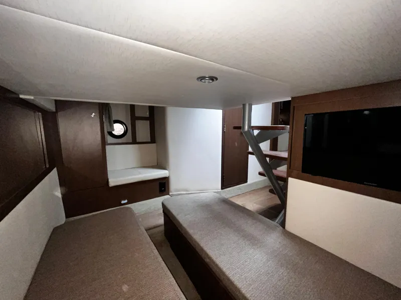 Slide: The Image of Interior of 2019 Sea Ray 350 Sundancer yacht with modern seating and stairs. - 25