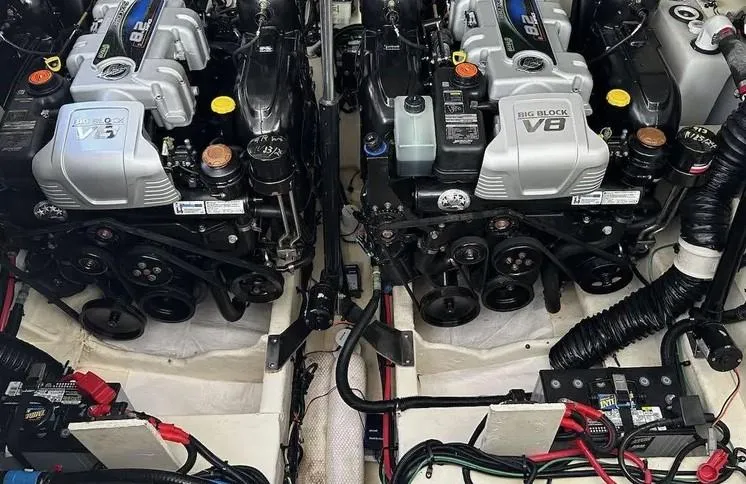 Slide: The Image of Twin engines of a 2019 Sea Ray 350 Sundancer boat, showcasing powerful V8 configuration. - 27