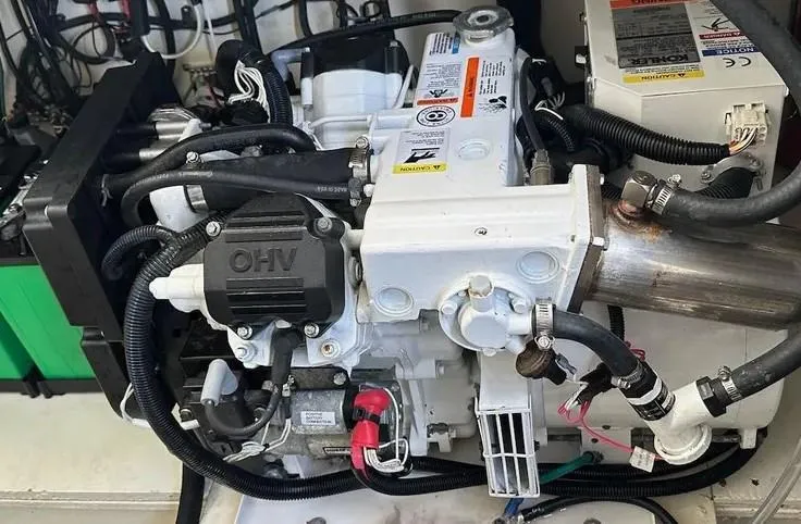 Slide: The Image of Engine compartment of a 2019 Sea Ray 350 Sundancer boat, showcasing mechanical components. - 28