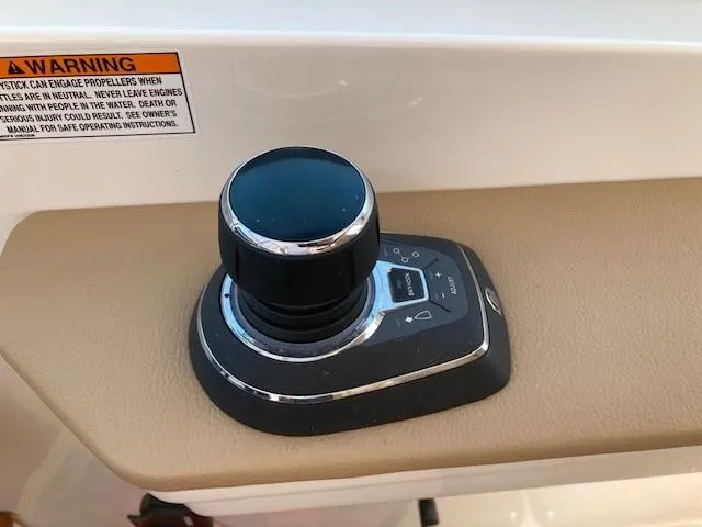 Slide: The Image of Joystick control on 2019 Sea Ray 350 Sundancer boat. - 8