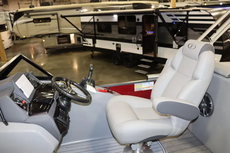 Slide: The Image of The image shows the helm of a 2022 Veranda VTX 22VLC boat with a comfortable seat. - 6