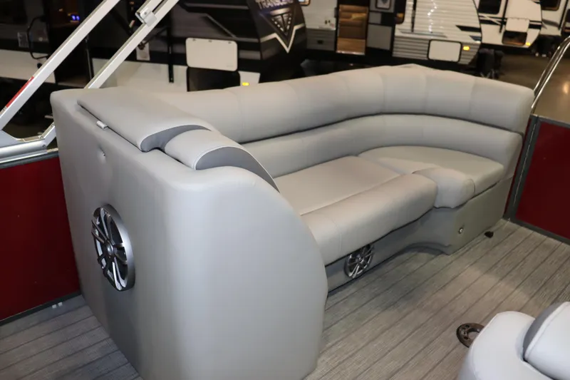 Slide: The Image of The image shows a gray seating area on a boat with speakers on the sides. - 11