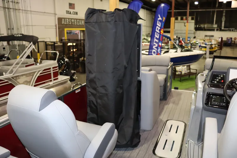 Slide: The Image of The image shows the interior of a 2022 Veranda VTX 22VLC boat in a showroom. - 9