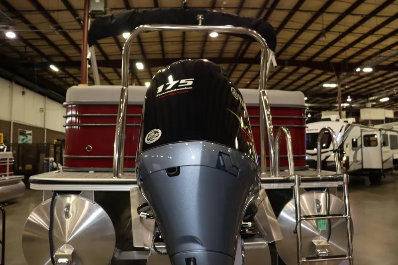 Slide: The Image of A 2022 Veranda VTX 22VLC with a 175 HP outboard motor in a warehouse setting. - 1