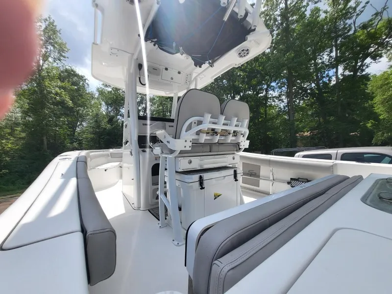 Slide: The Image of 2019 Sea Pro 239 Center Console boat with seating area and helm station. - 15