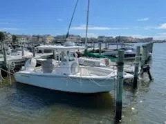 Slide: The Image of 2019 Sea Pro 239 Center Console boat docked at marina. - 17