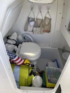 Slide: The Image of Interior of 2019 Sea Pro 239 with toilet and storage. - 21