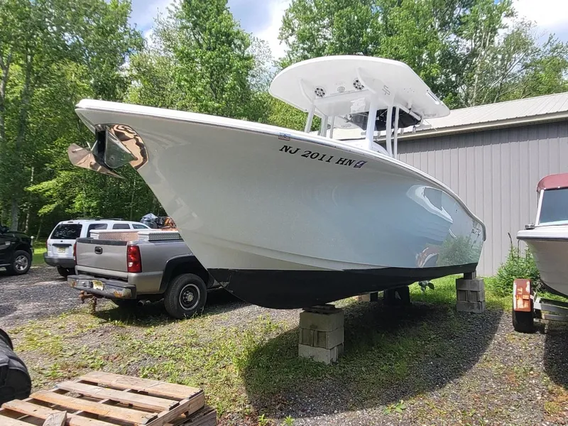 Slide: The Image of 2019 Sea Pro 239 Center Console boat elevated outdoors. - 3