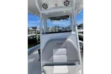 Slide: The Image of 2019 Sea Pro 239 Center Console boat interior with seating and speakers. - 30