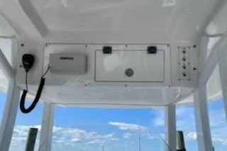 Slide: The Image of 2019 Sea Pro 239 Center Console boat dashboard with clear sky background. - 33