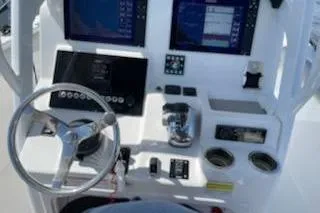 Slide: The Image of 2019 Sea Pro 239 Center Console dashboard with steering wheel and electronic displays. - 34