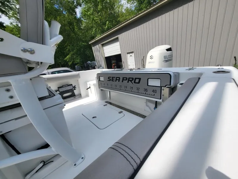 Slide: The Image of 2019 Sea Pro 239 Center Console boat interior, Suzuki motor in background. - 4