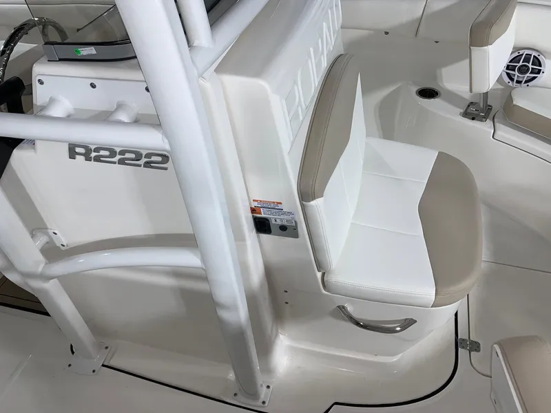 Slide: The Image of 2024 Robalo R222 Center Console boat interior with seating and console details. - 13