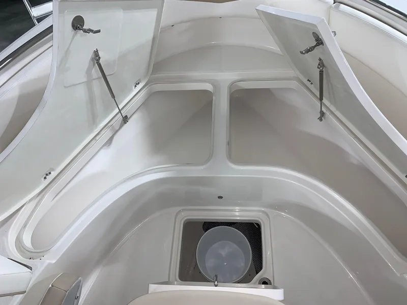 Slide: The Image of 2024 Robalo R222 Center Console boat storage compartments. - 15
